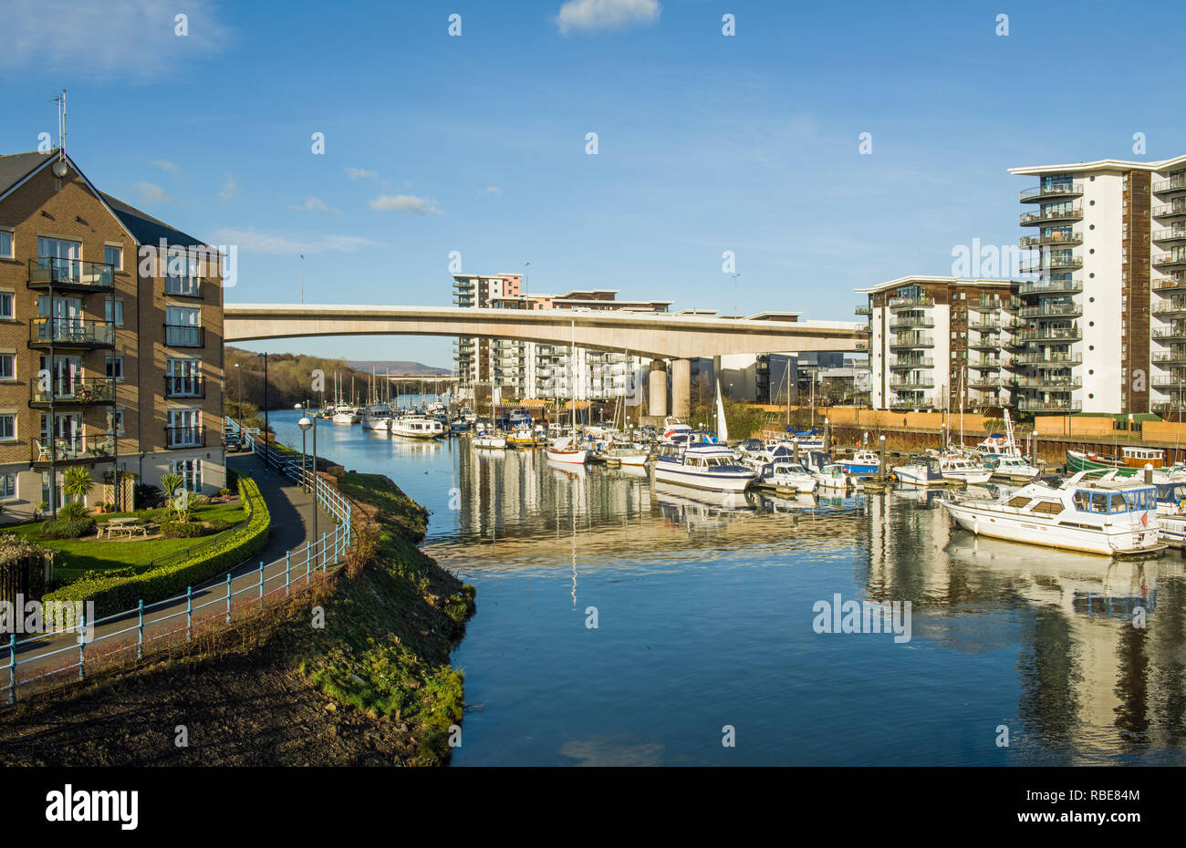The River Ely coming into Cardiff Bay lined with apartments and full of