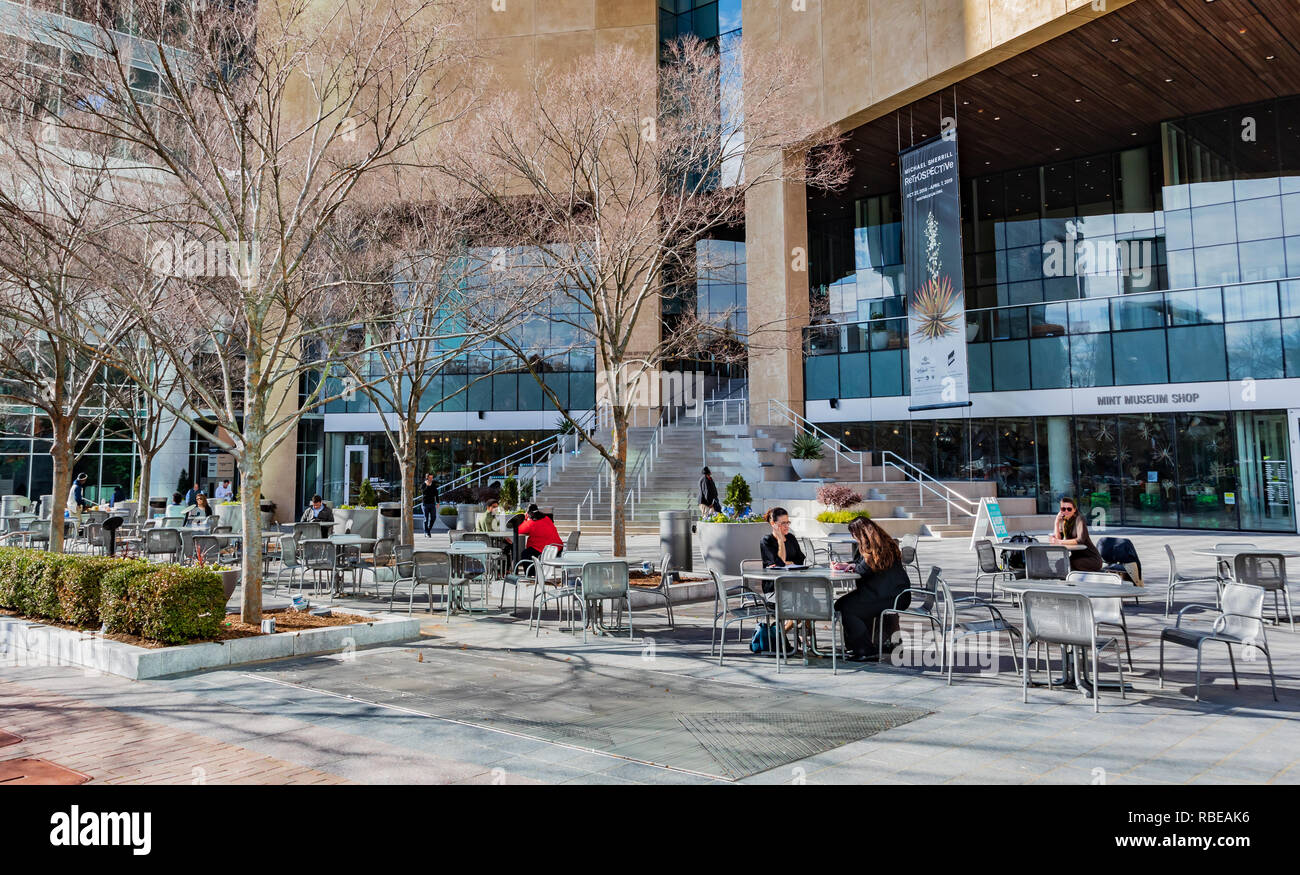 CHARLOTTE, NC, USA-1/8/19: The veranda in front of the Mint Museum in uptown attracts social life on a warm, sunny January day. Stock Photo