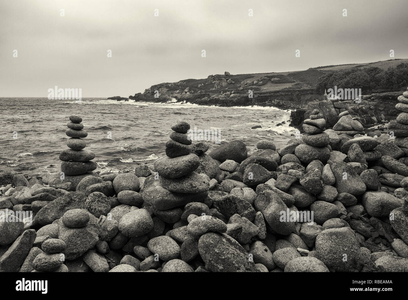 Stone cairn sculptures, Old Town Bay, St. Mary's, Isles of Scilly, UK.  Black and white version Stock Photo