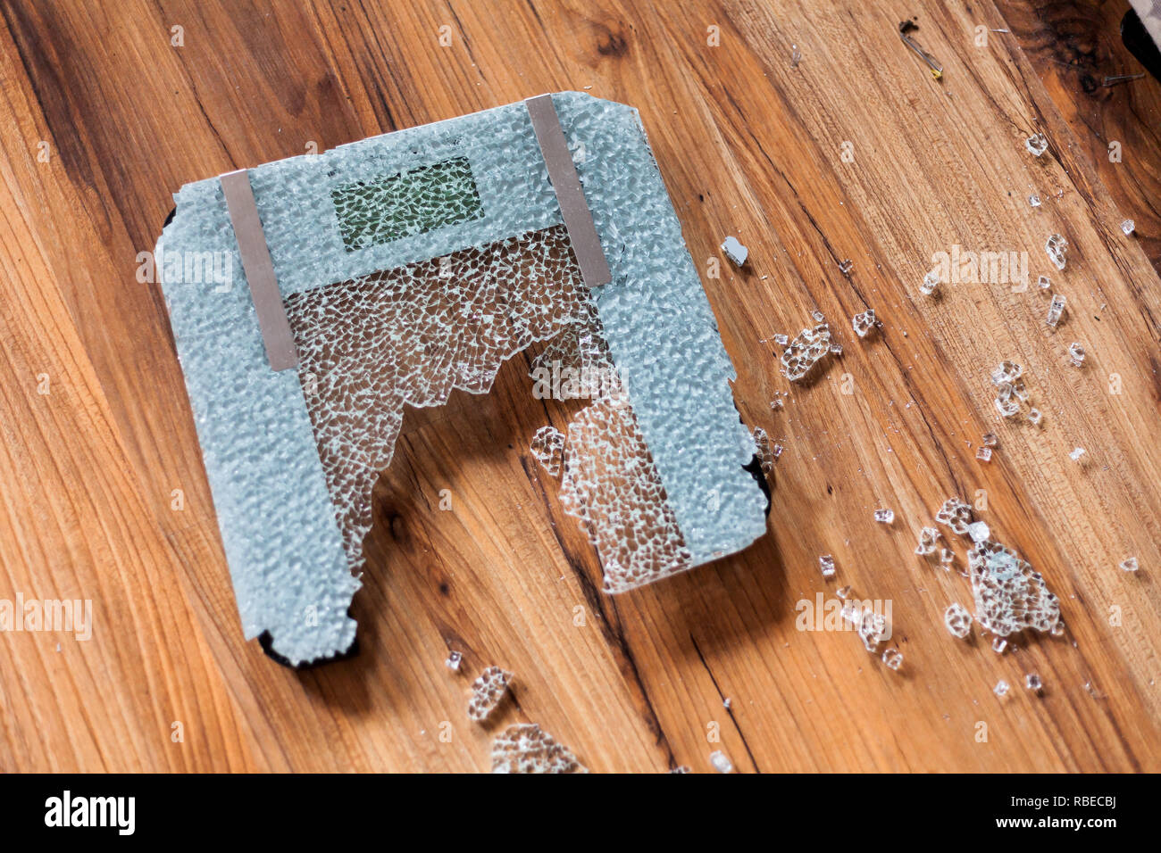 Broken digital human scale on the floor. Broken glassy digital scale