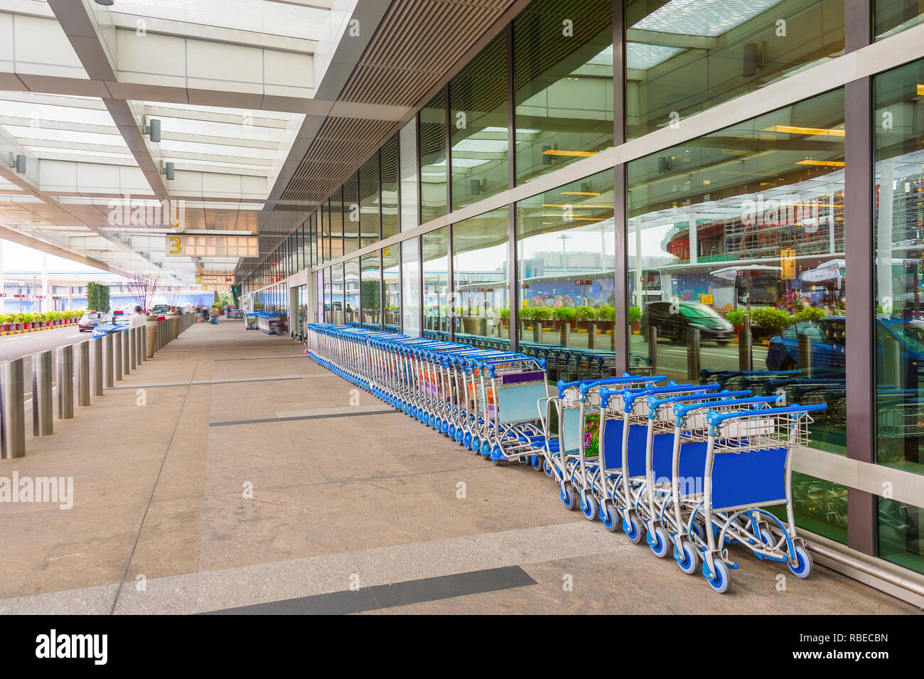 Baggage trolleys changi airport singapore hires stock photography and