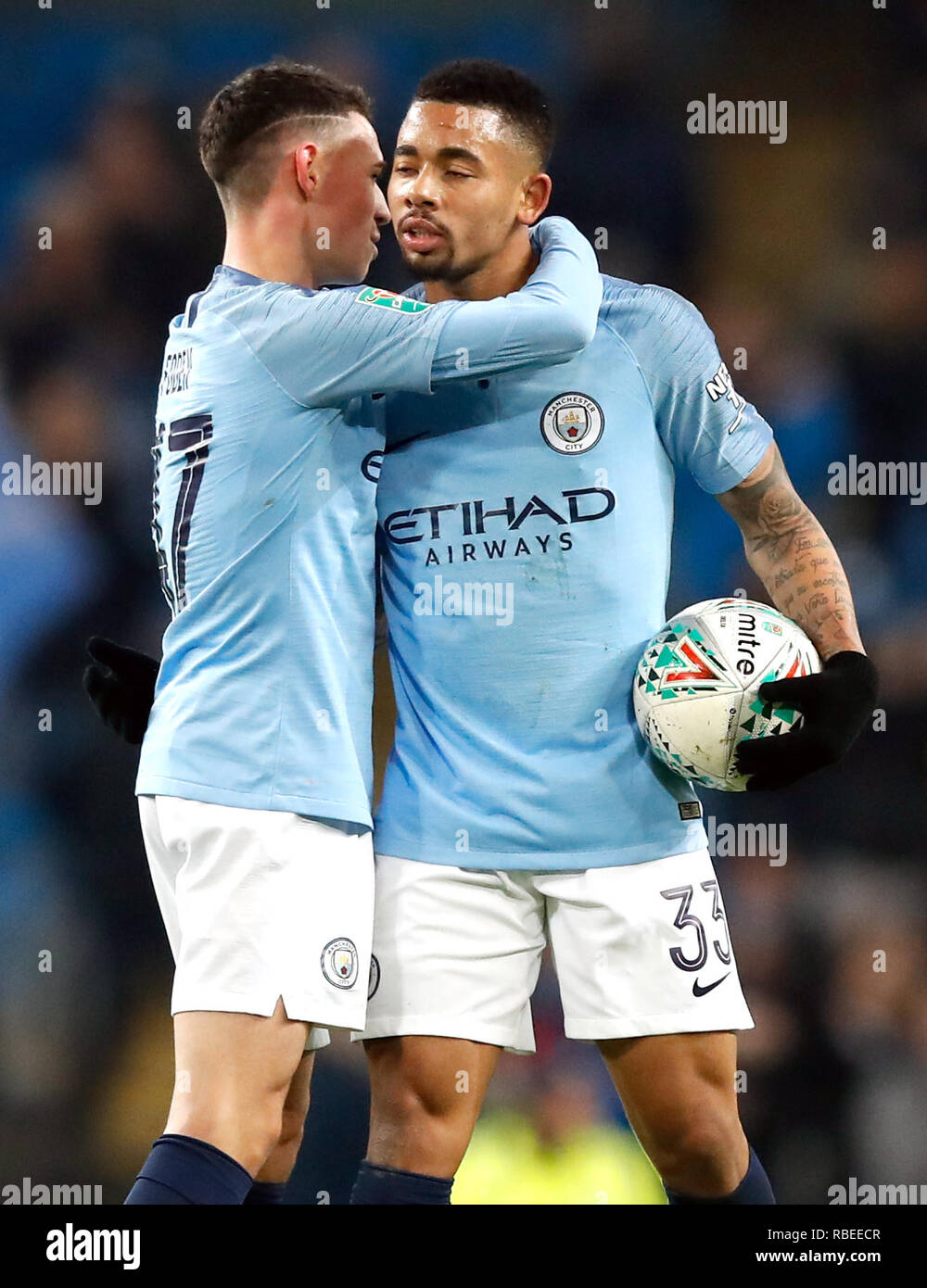 Manchester City S Gabriel Jesus Right Celebrates With Phil Foden And The Matchball After The Carabao Cup Semi Final Match At The Etihad Stadium Manchester Stock Photo Alamy