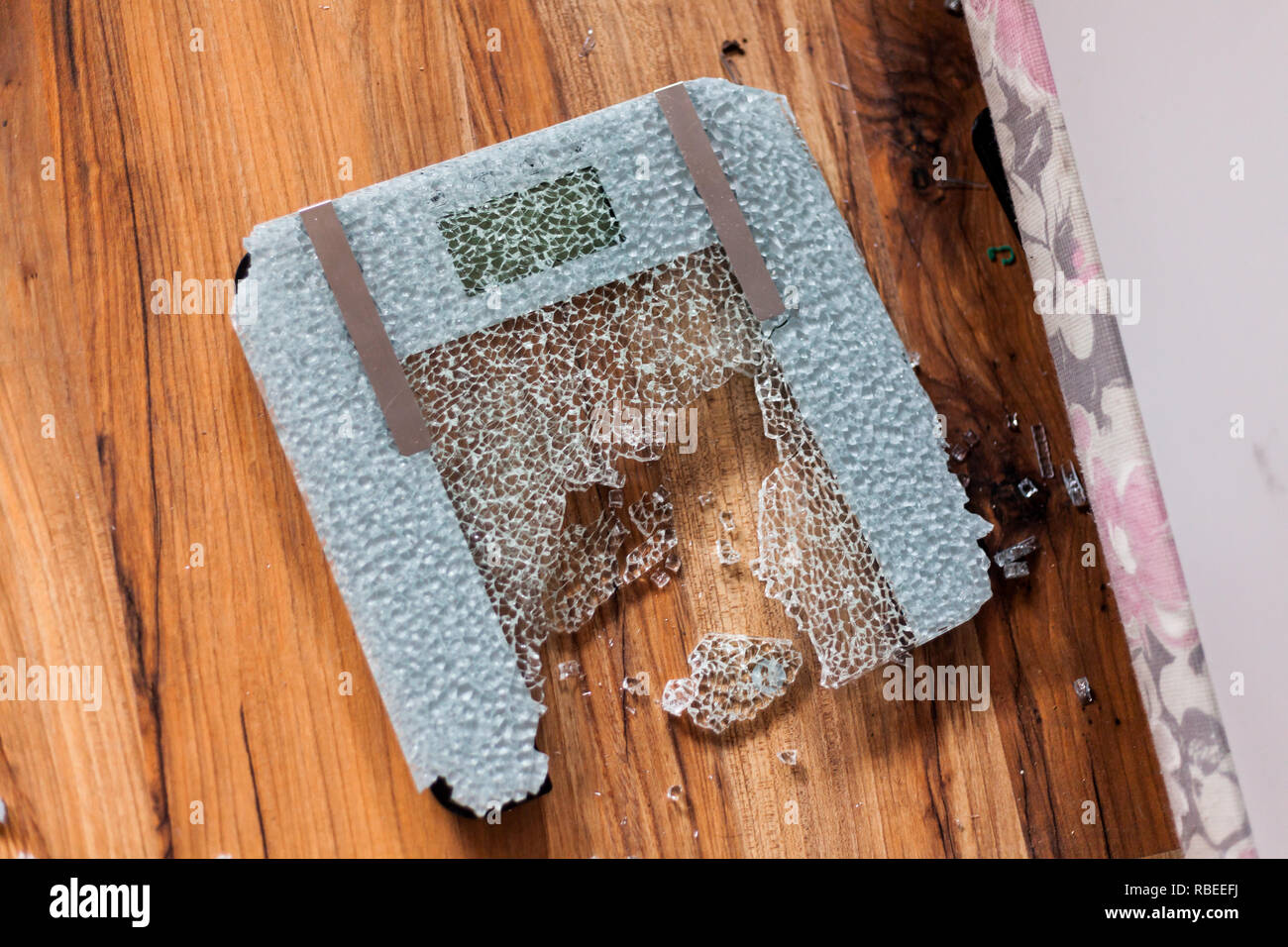 Broken digital human scale on the floor. Broken glassy digital scale