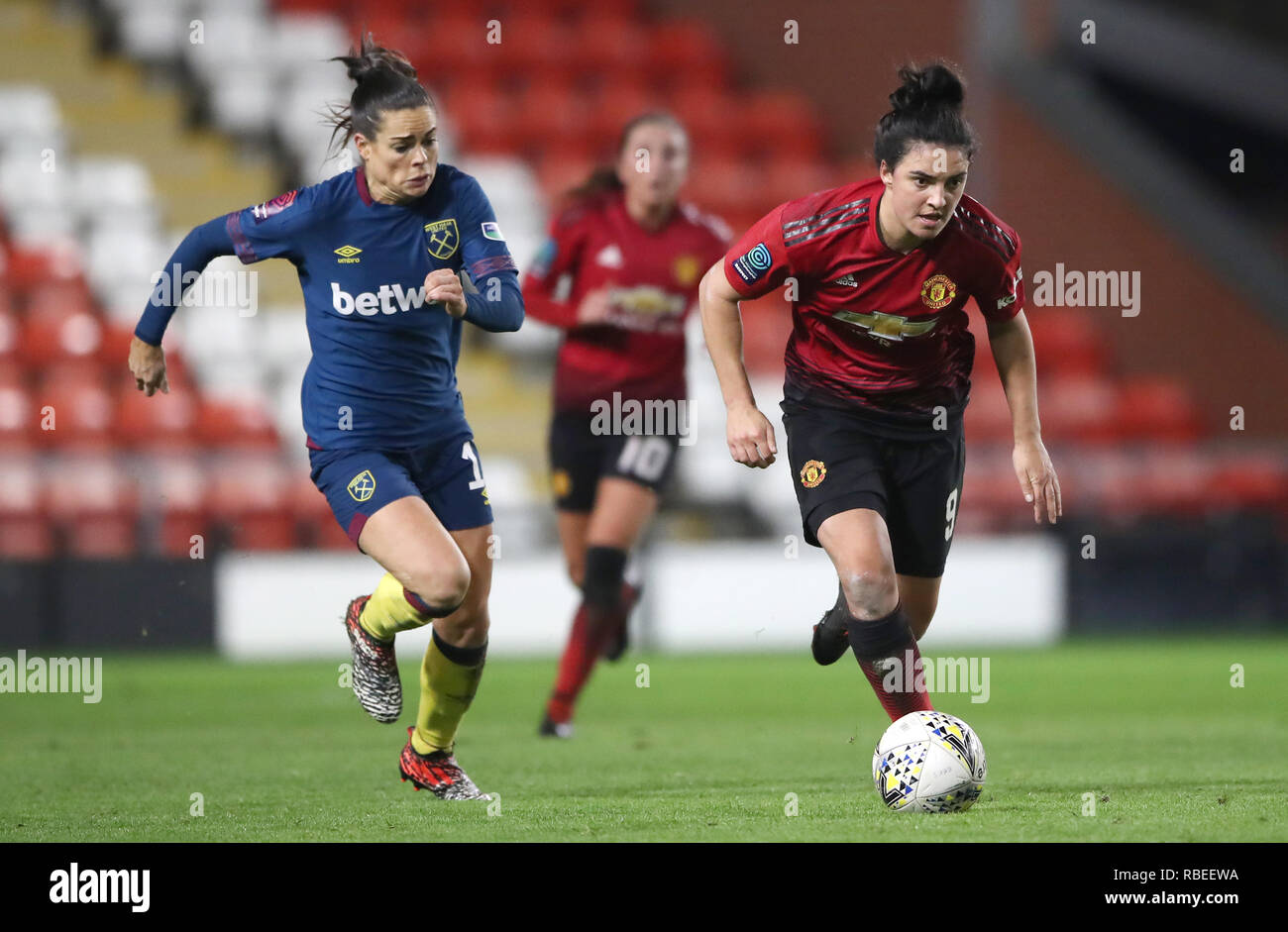 Manchester United's Jess Sigsworth (right) gets away from West Ham ...