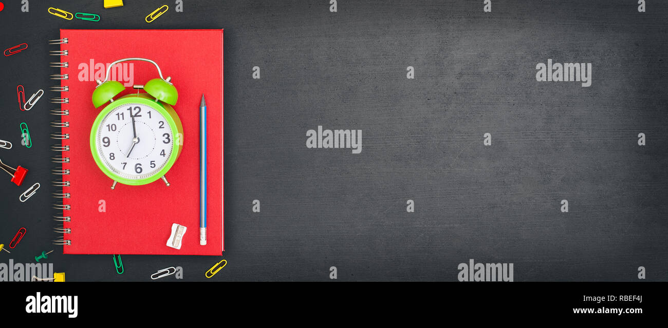 back to school concept with alarm clock on the blackboard Stock Photo ...