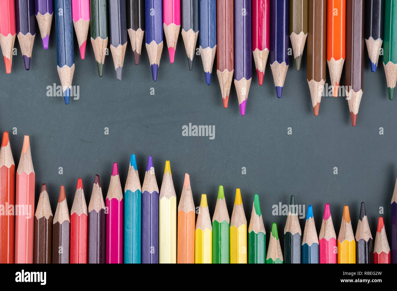 black board on color pencils Stock Photo
