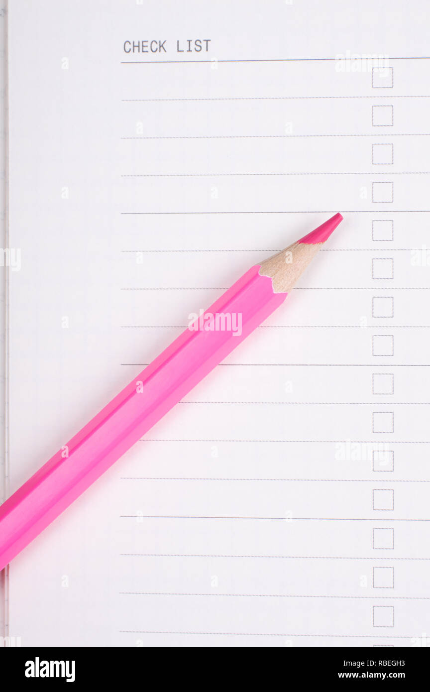 red or pink pencil on white note Stock Photo - Alamy