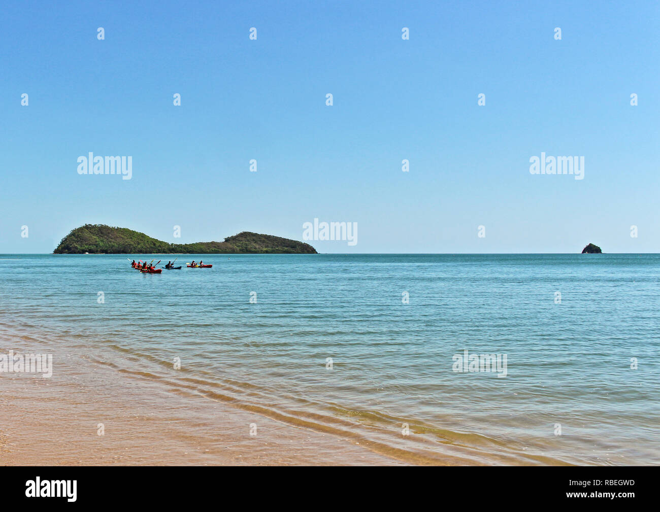 Kayak tour on the way back from Double Island off Palm Cove beach, Cairns, Far North Queensland Australia Stock Photo