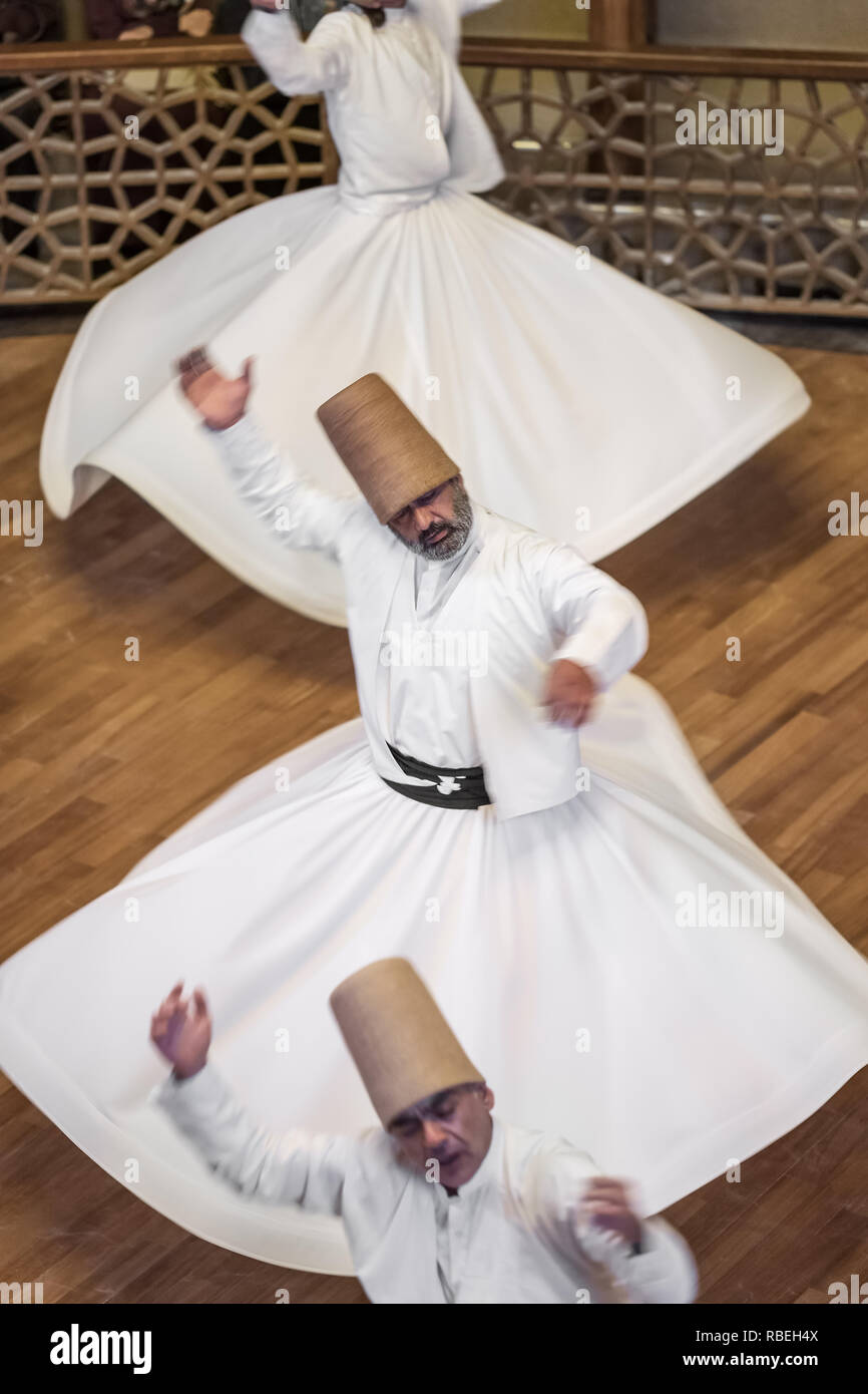 Konya, Turkey - October 21, 2018: Semazen or Whirling Dervishes at Mevlana Culture Center in Konya, Turkey Stock Photo