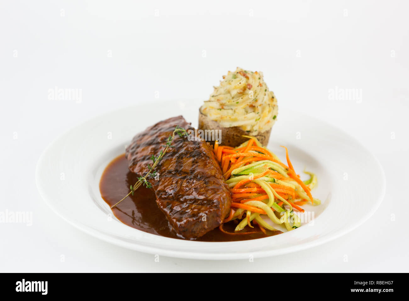 Plated steak dinner Stock Photo