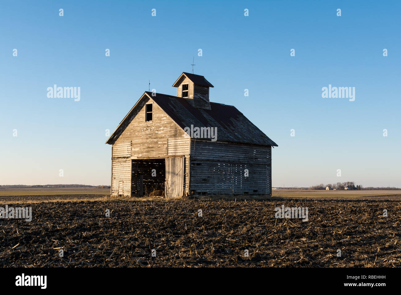 Isolated midwest barn on a cold winters day approaching sunset Stock
