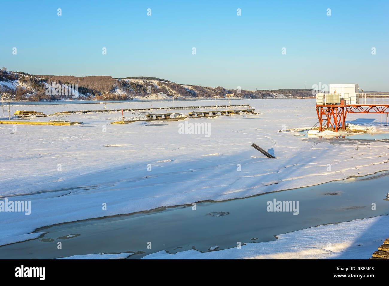 Melting of ice on the river in early spring under the warm rays of the sun Stock Photo