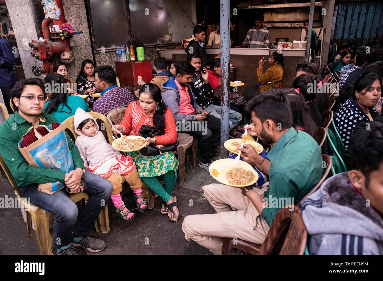 Christmas-eve,families ,enjoying Cinese ,fast food,way side,eatery,New market, Kolkata,India. Stock Photo