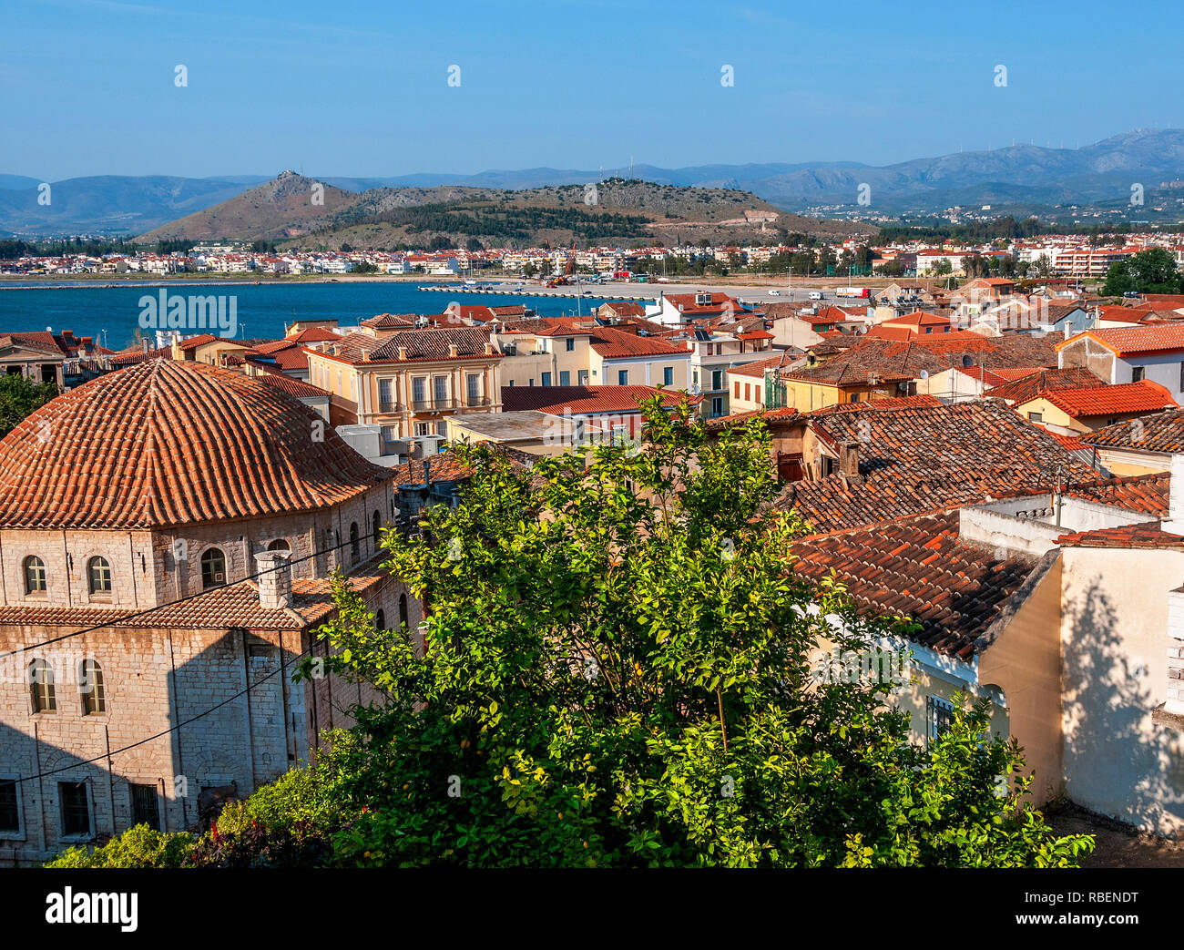 High aspect view over the rooftops of the town of Nafplion or Nafplio on the Argolic Gulf, Peloponnese, Greece Stock Photo