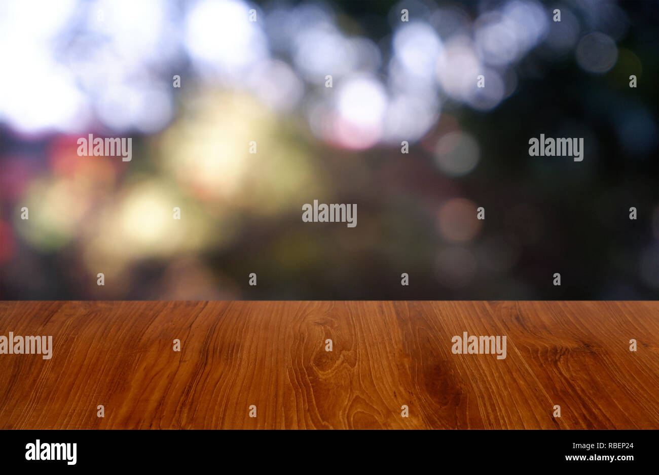 Empty wooden table in front of abstract blurred green of garden and house background. For montage product display or design key visual layout - Image Stock Photo