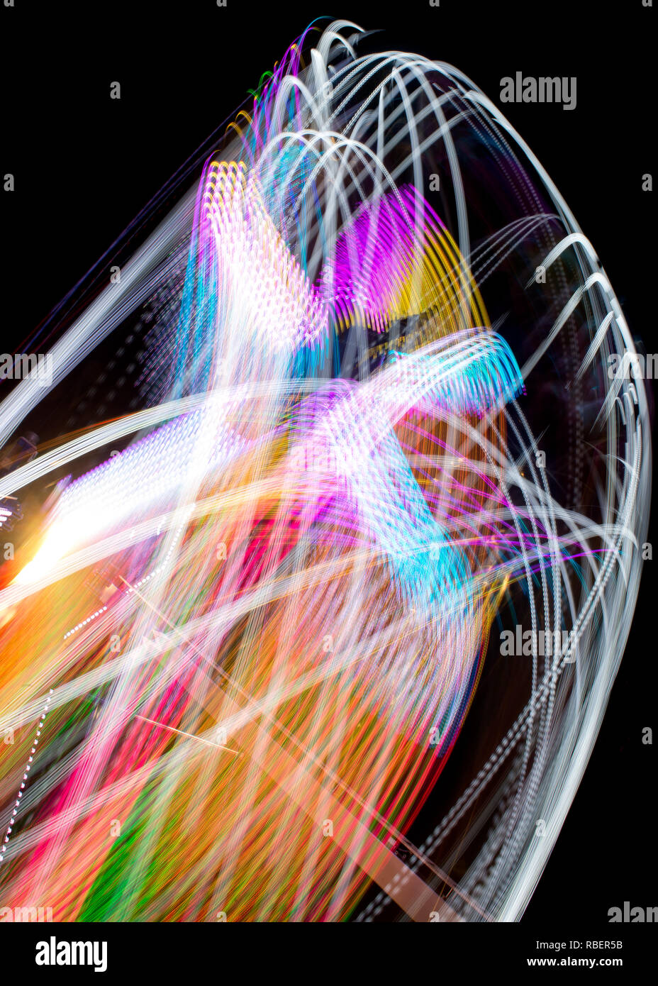 Long Exposure Of A Spinning Carnival Ride Stock Photo - Alamy