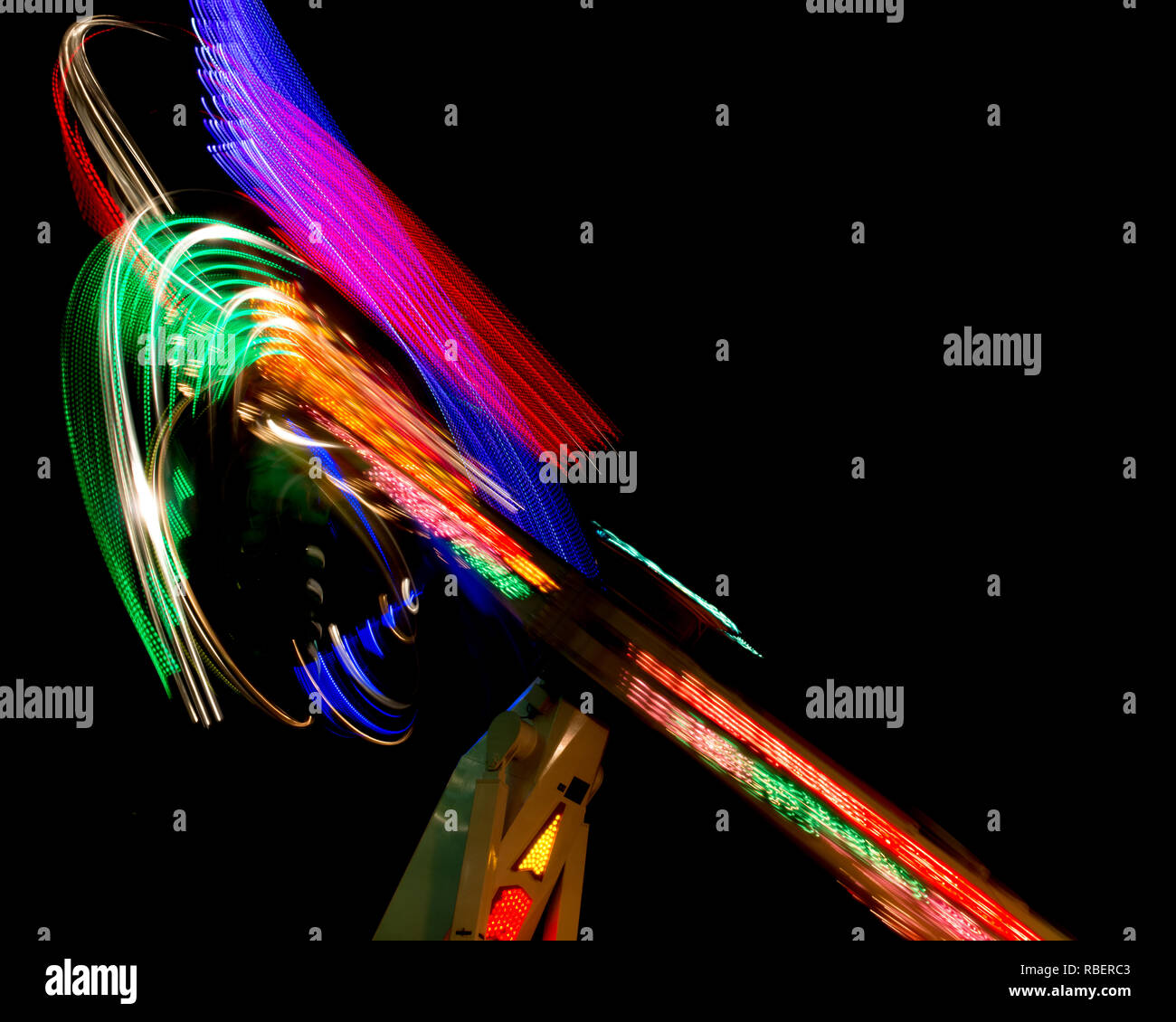 Long Exposure Of A Spinning Carnival Ride Stock Photo - Alamy