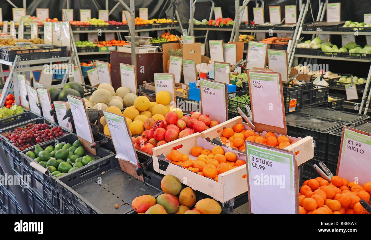 Fresh organic fruits and vegetables sold on market shelves in Amsterdam Stock Photo