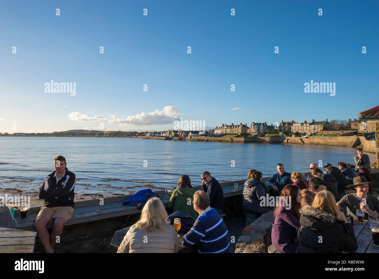 Afternoon drinks at the Ship Inn beer garden in Elie, Fife, Scotland, UK Stock Photo