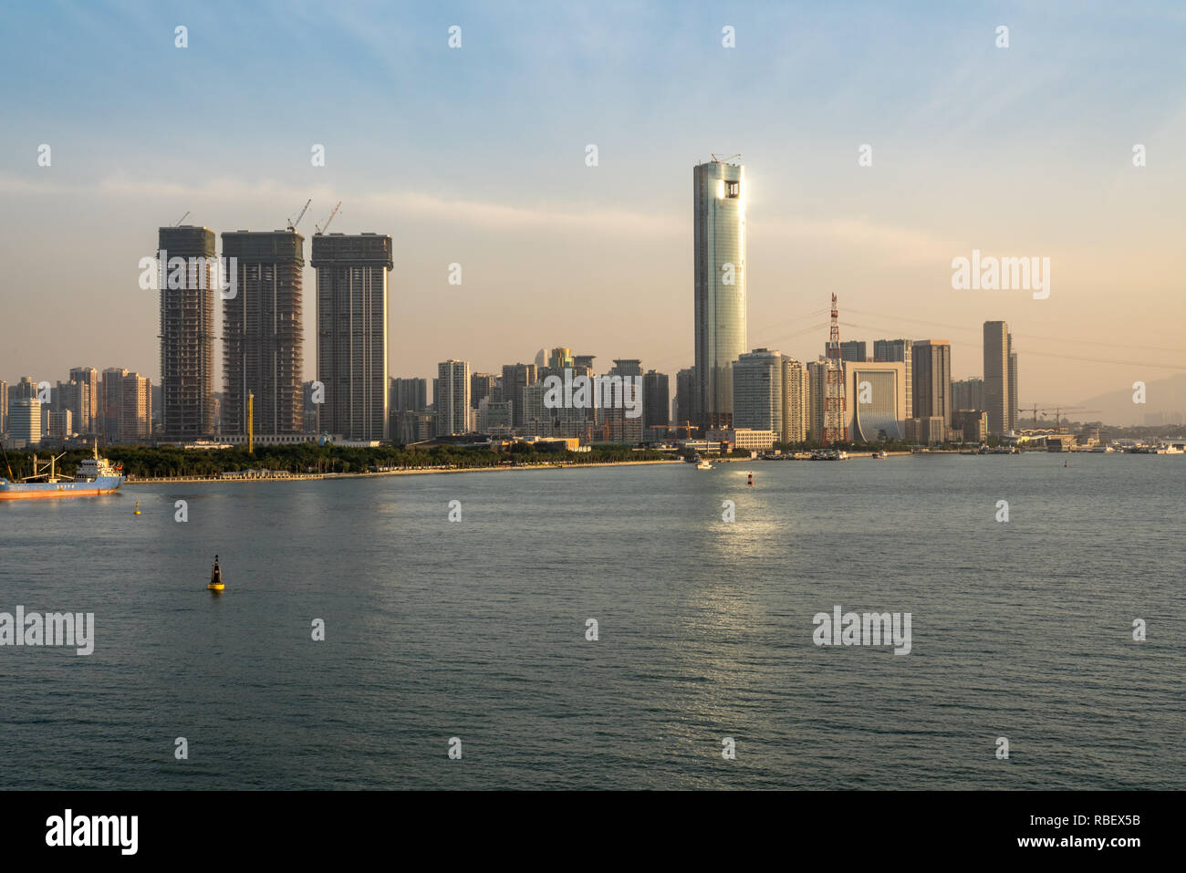 Skyline of the city of Xiamen from the sea approaching port Stock Photo