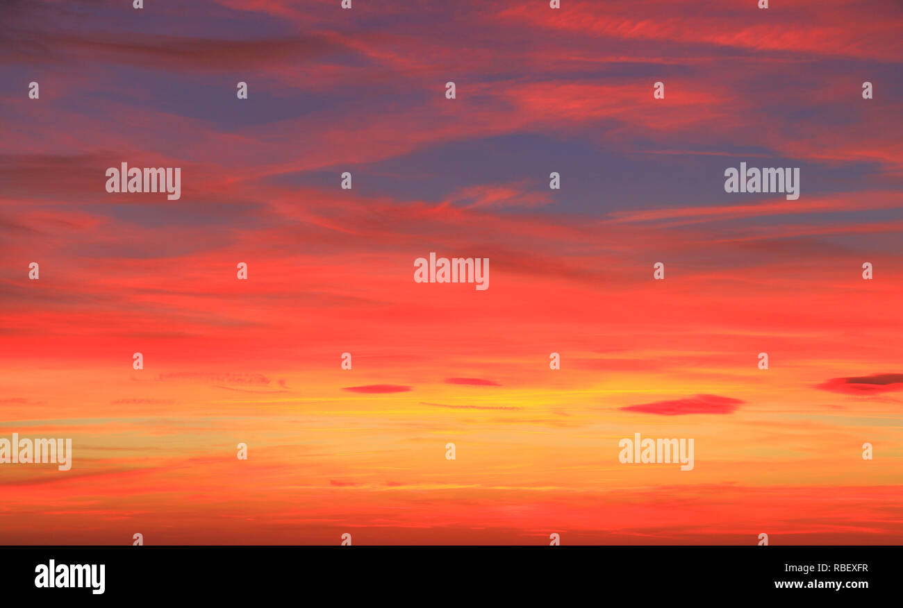 Red, orange, pink, blue, sky, after sunset, skies, cloud, clouds, formation, multi coloured, colours, colour, color Stock Photo