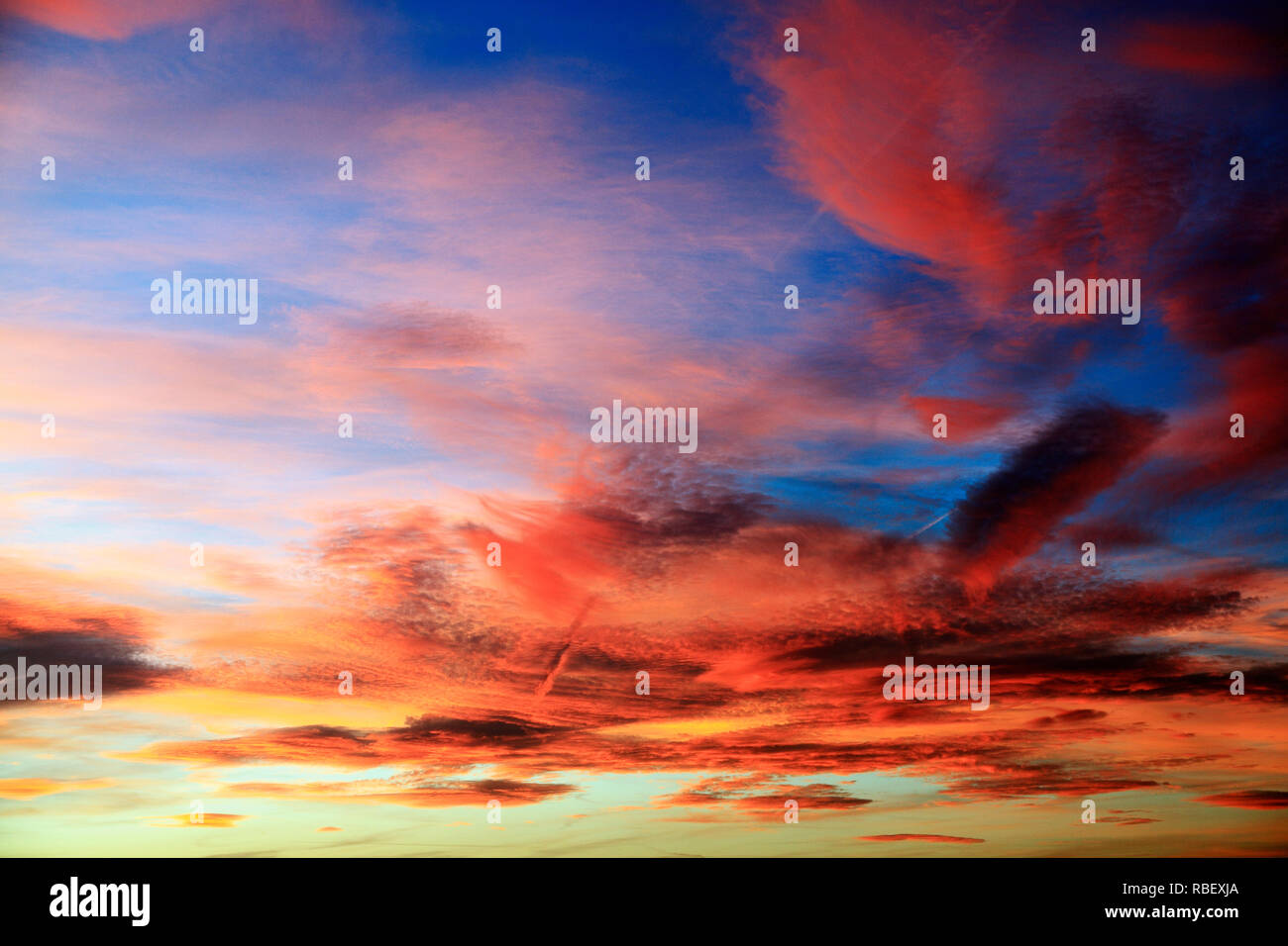 Red, orange, pink, blue, sky, after sunset, skies, cloud, clouds, formation, multi colour, colours, after the sun goes down, many colours,  skies Stock Photo