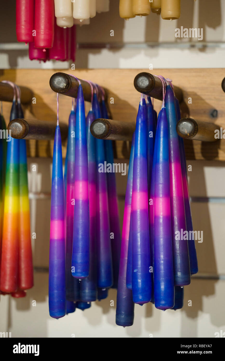 Handmade rainbow coloured candles for sale at Rheged centre in Cumbria