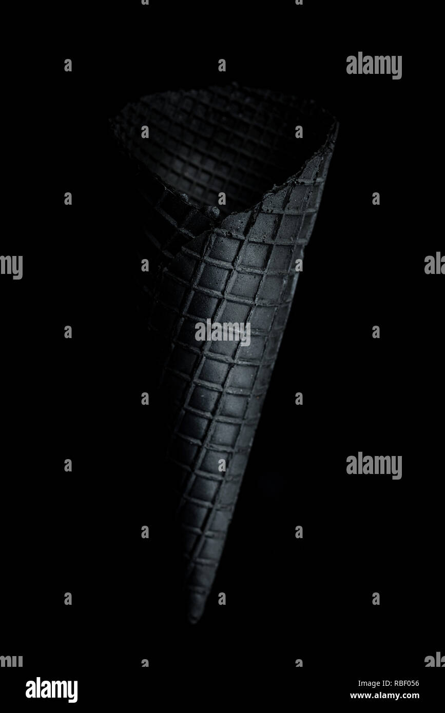Black empty wafer cone on dark background Stock Photo - Alamy