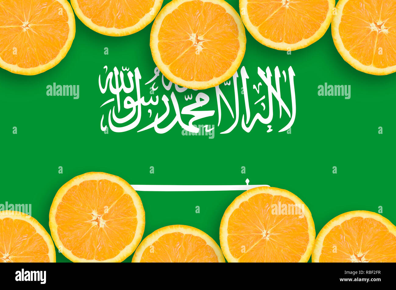 Saudi Arabia flag in horizontal frame of orange citrus fruit slices