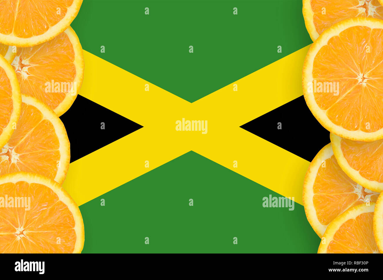 Jamaica flag in vertical frame of orange citrus fruit slices. Concept