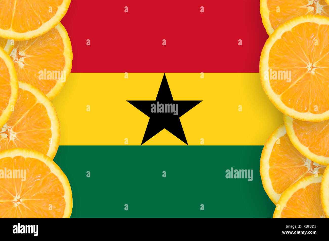 Ghana flag in vertical frame of orange citrus fruit slices. Concept of