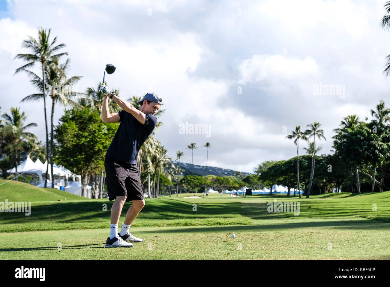 Honolulu, Hawaii, USA. 9th Jan, 2019. Tom Holland who plays the role of Spider Man in the Avengers movie hits his tee shot on the 10th hole during the Pro/Am day before the Sony Open at Waialae Country Club in Honolulu, Hawaii. Glenn Yoza/CSM/Alamy Live News Stock Photo