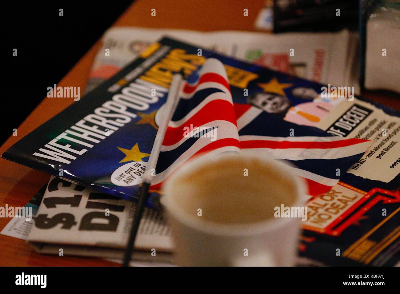 Hastings, East Sussex, UK. 10 Jan, 2019. Wetherspoon founder and chairman Tim Martin visited The John Logie Baird pub in Hastings, East Sussex. He will talk to members of the public about what he considers to be the huge economic advantages of leaving the european union. Wetherspoons news brochure with british flag on a coffee table in the pub. PLEASE SEE IMAGE REF: W6E0FA for updated cleaner image. © Paul Lawrenson 2018, Photo Credit: Paul Lawrenson / Alamy Live News Stock Photo
