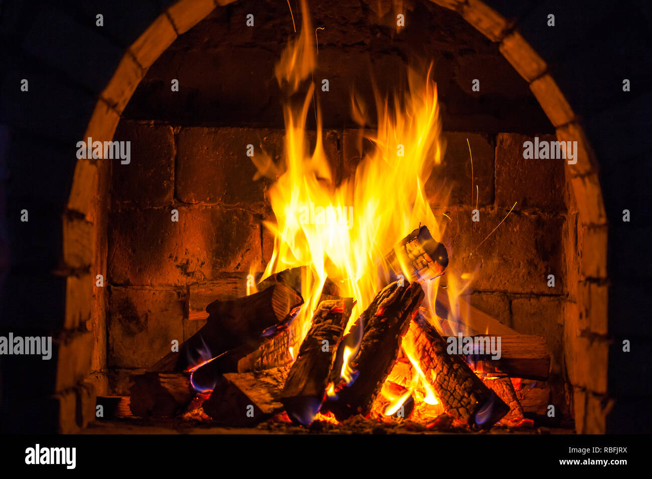 Wood Burning In A Cozy Fireplace At Home Keep Warm Stock Photo