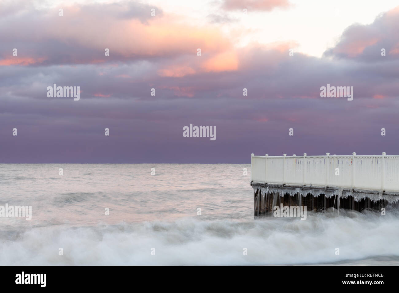 Sunset at the beach, cloudy sky Stock Photo - Alamy