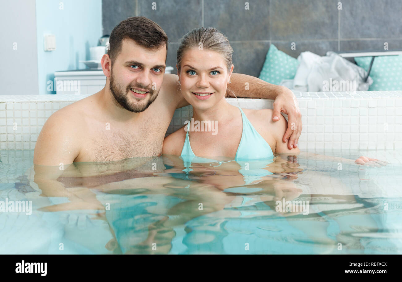 Young family having wellness weekend jacuzzi in spa center Stock Photo - Alamy