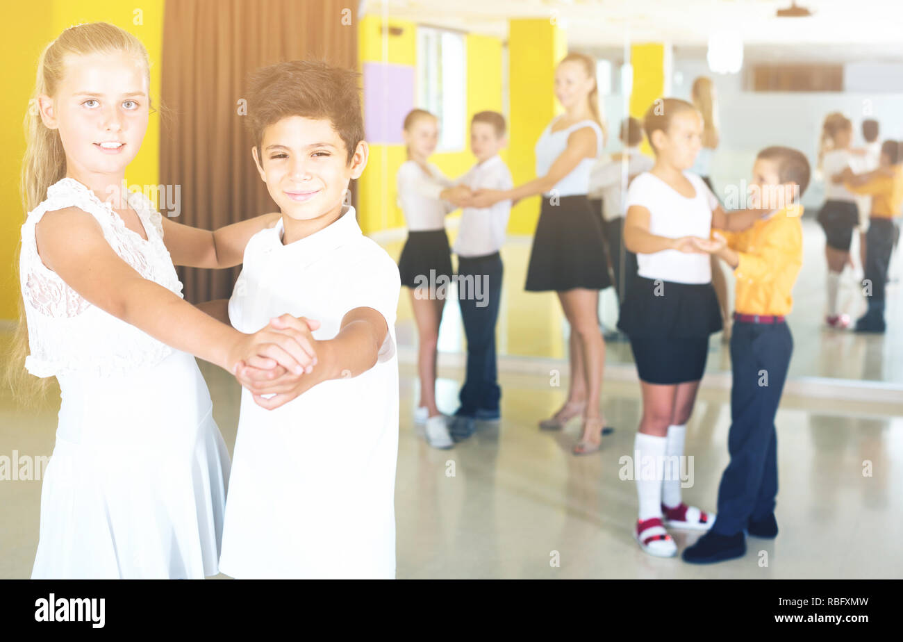 Kids are dancing tango in class Stock Photo - Alamy