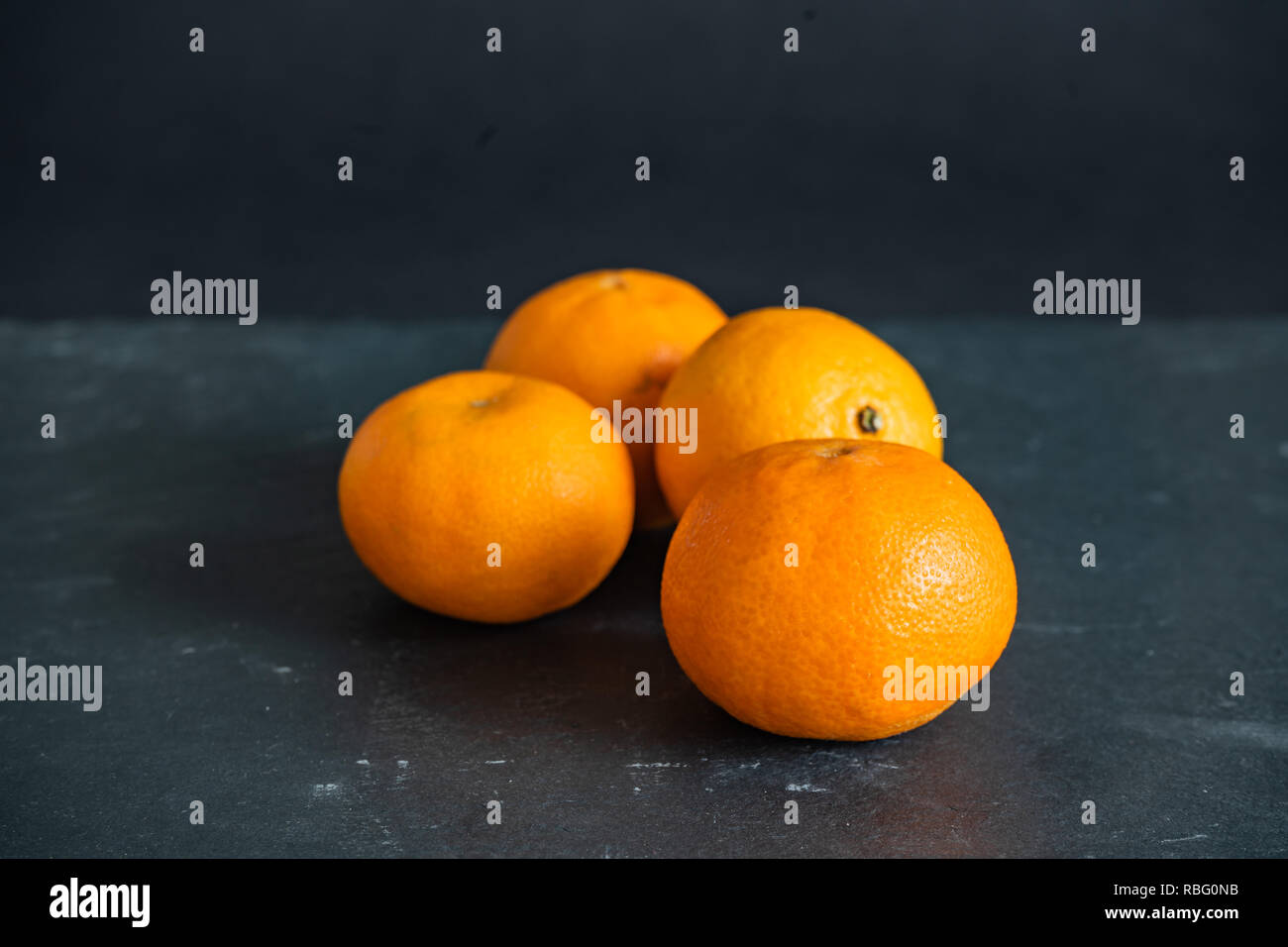 Mandarins on a dark background Stock Photo