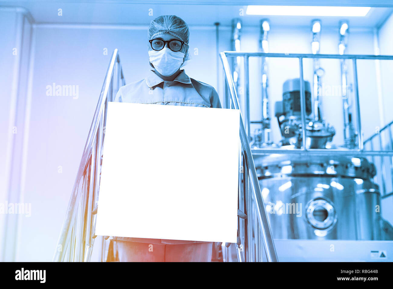 food technician works in a factory. Blue tone. Blue tint Stock Photo