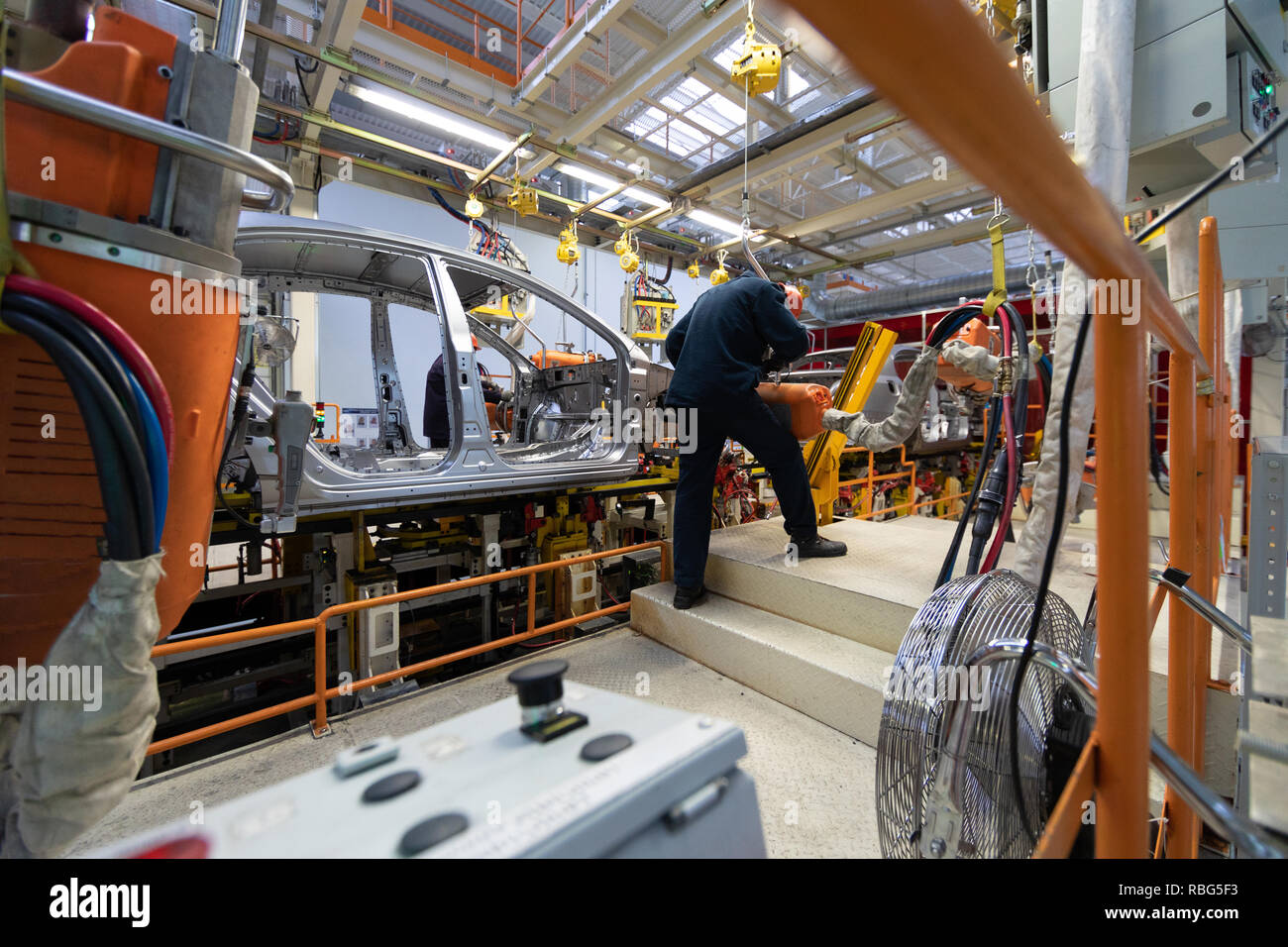 Automotive assembly line workers hires stock photography and images