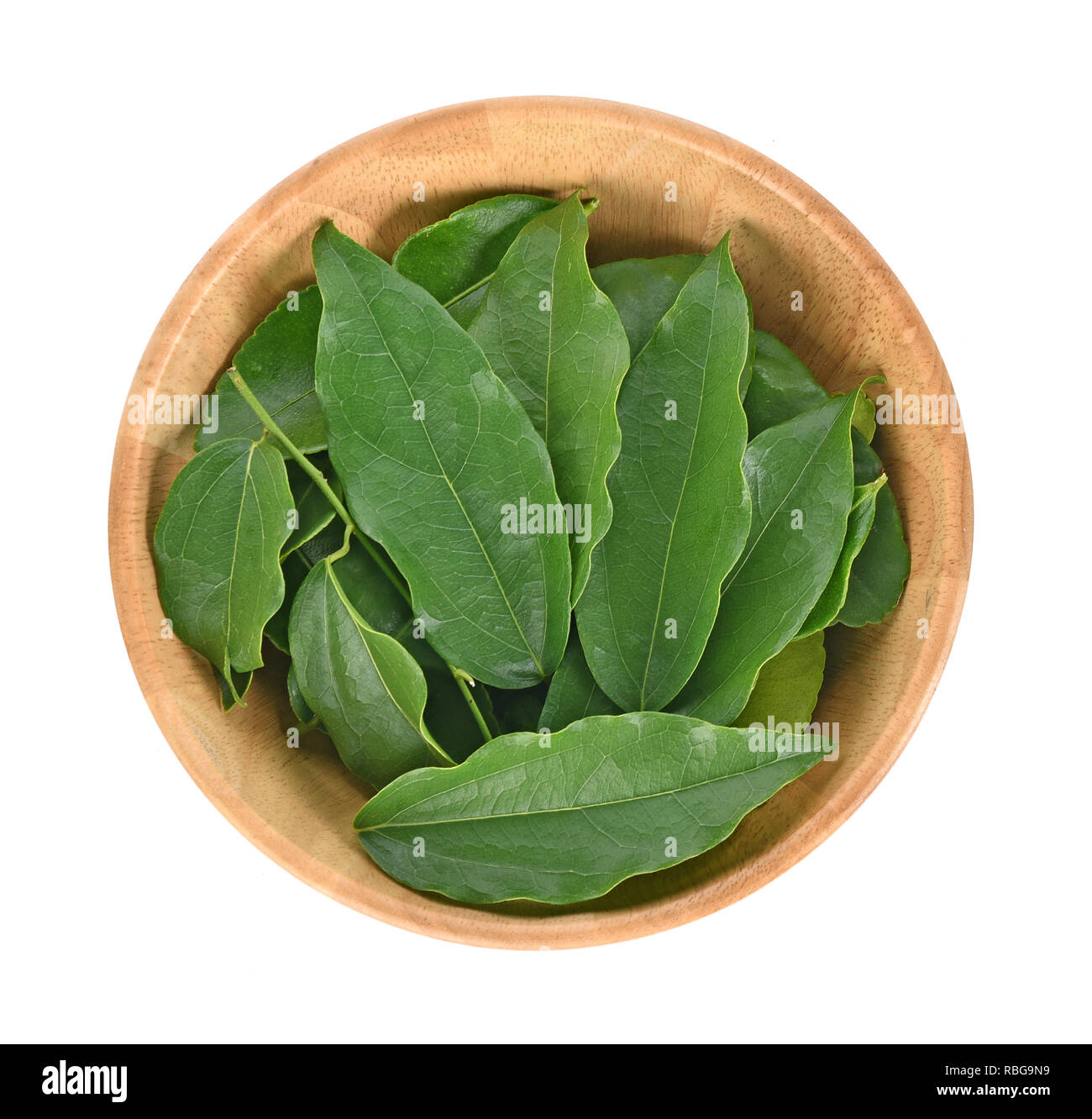 Top view of Yanang leaf in wooder bowl on white background Stock Photo