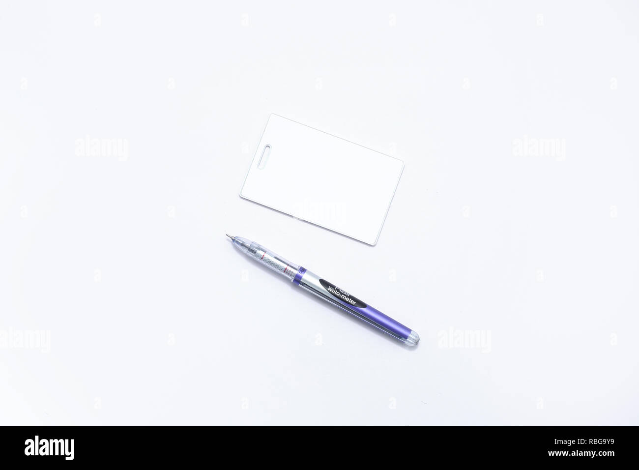 Picture of tag card and ball pen. Isolated on the white background. Stock Photo