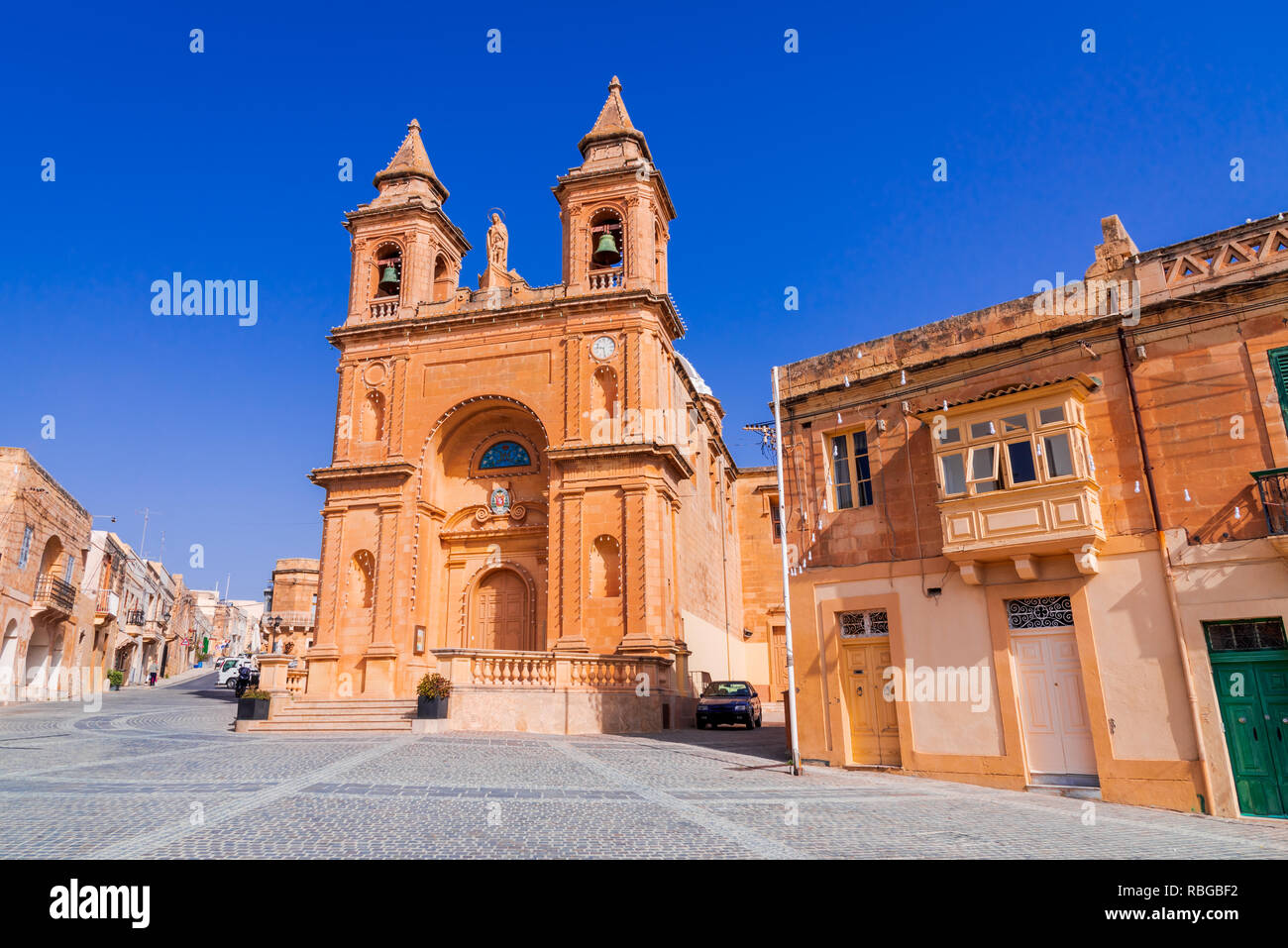 Marsaxlokk, Malta. Medieval church in traditional fishing village Marsaxlokk, Mediterranean Sea. Stock Photo