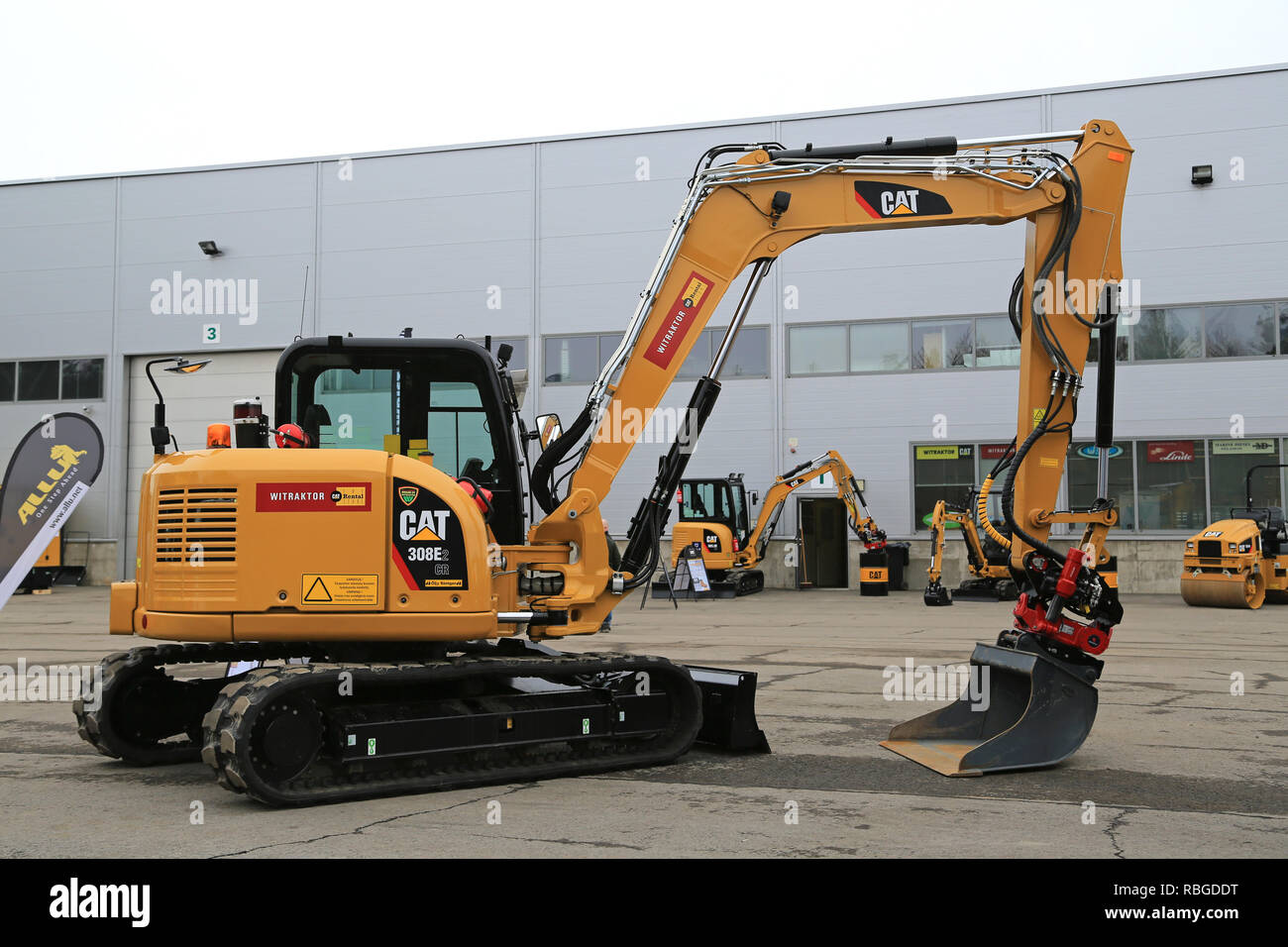 LIETO, FINLAND - MARCH 12, 2016: Cat 308E2 CR Mini Hydraulic Excavator with swing boom and other Cat construction equipment seen at the public event o Stock Photo