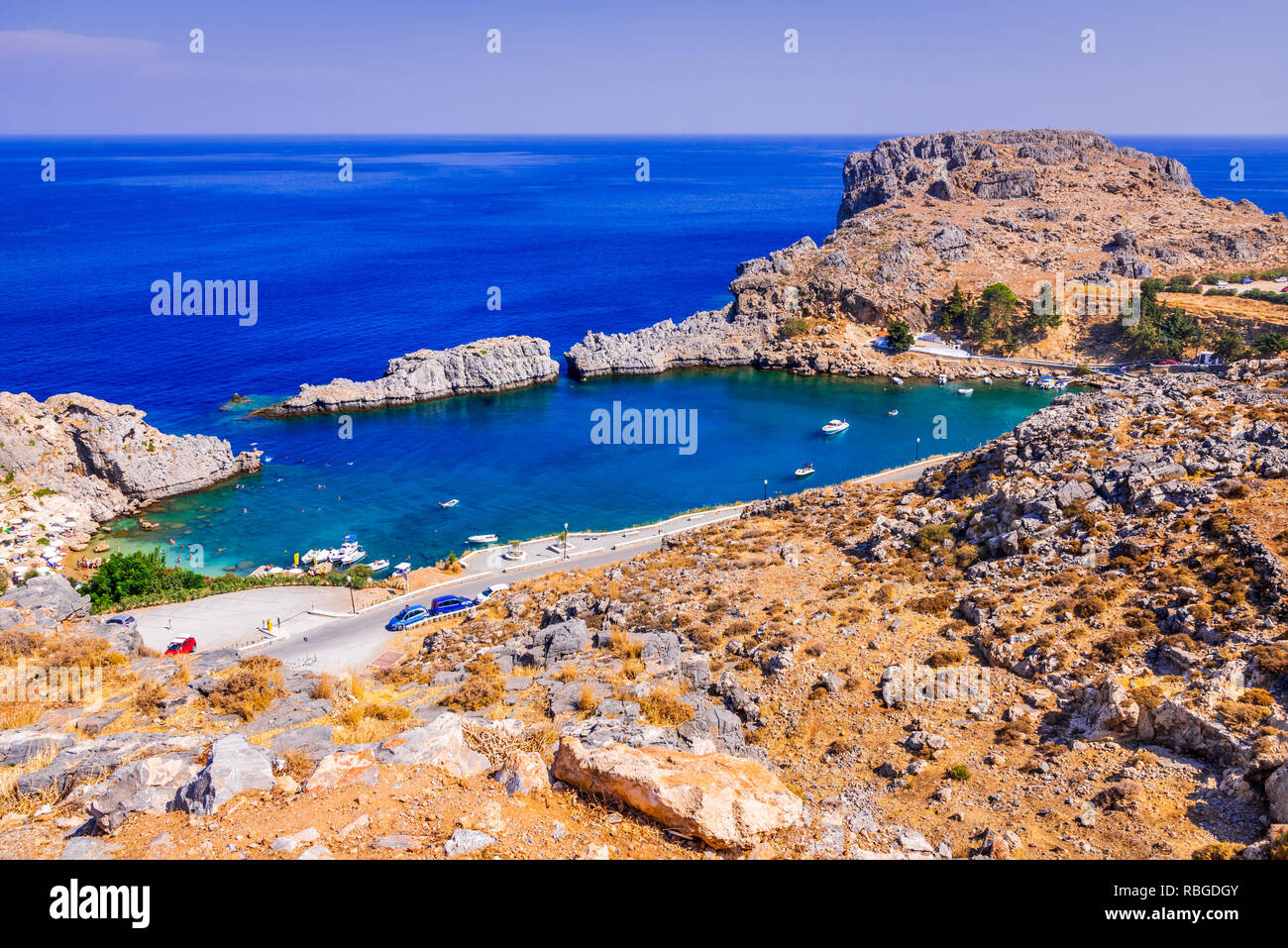 Rhodes, Greece. Lindos small whitewashed village and the Acropolis, scenery of Rhodos Island at Aegean Sea. Stock Photo