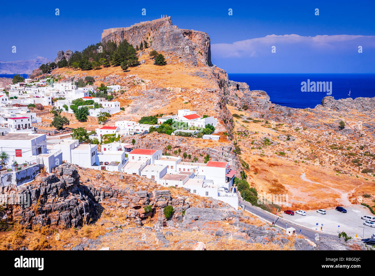 Rhodes, Greece. Lindos small whitewashed village and the Acropolis, scenery of Rhodos Island at Aegean Sea. Stock Photo