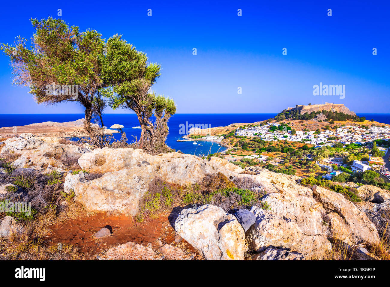 Rhodes, Greece. Lindos small whitewashed village and the Acropolis, scenery of Rhodos Island at Aegean Sea. Stock Photo