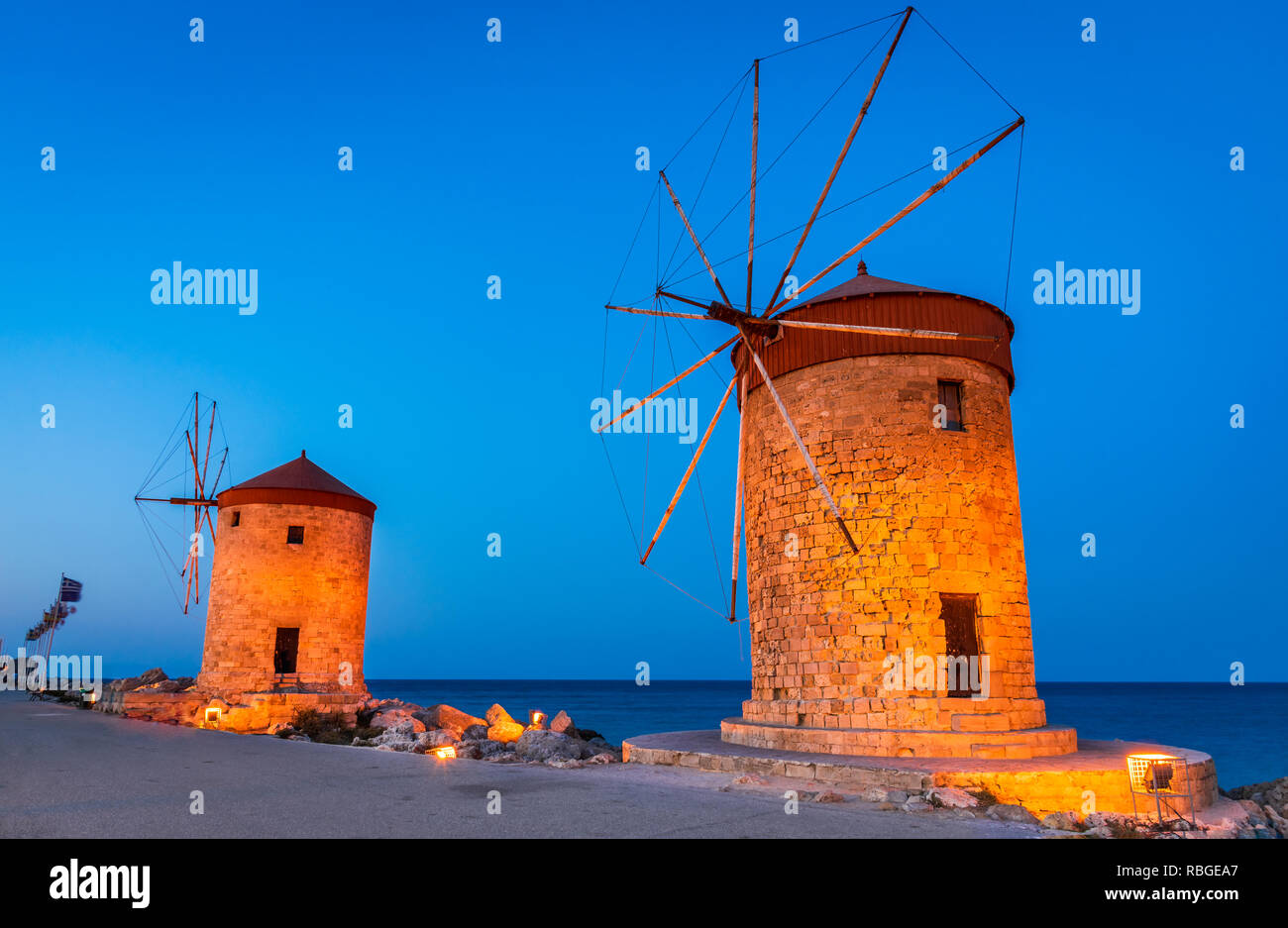 Rhodes, Greece. Stunning night image of Mandraki old harbour windmills in Dodecanese Islands. Stock Photo