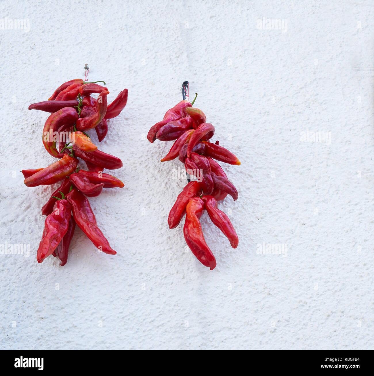 Red hot chili peppers hanging in Alpujarras of Granada facades to dry Stock Photo Alamy