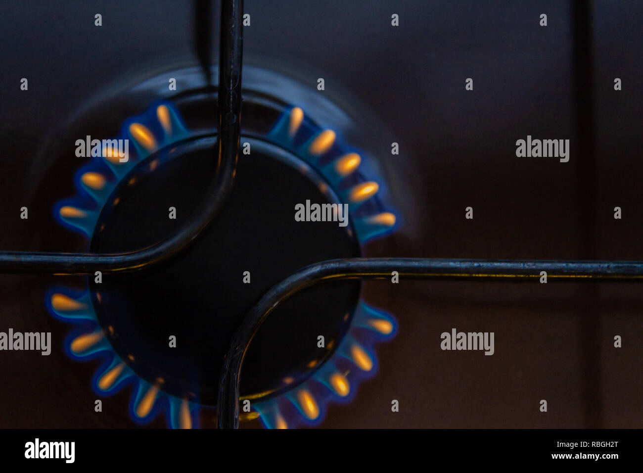 Gas stove with burning orange and blue fire on it Stock Photo Alamy